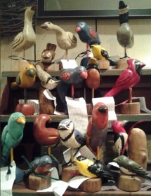 assorted painted wooden birds
